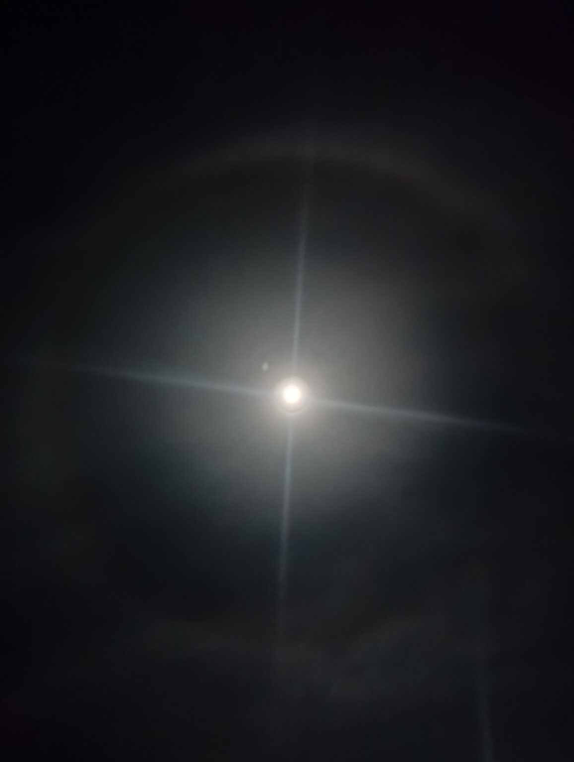 What's this circle of clouds I see forming perfectly around the moon?