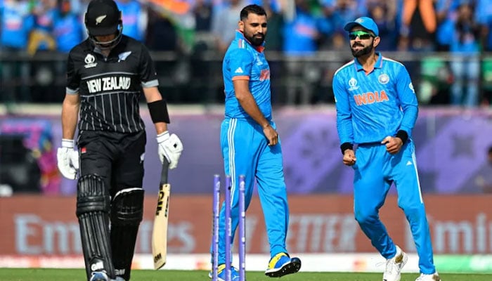 Virat Kolhi and Muhammad Shami celebrating after taking wicket of New Zealand player. — AFP