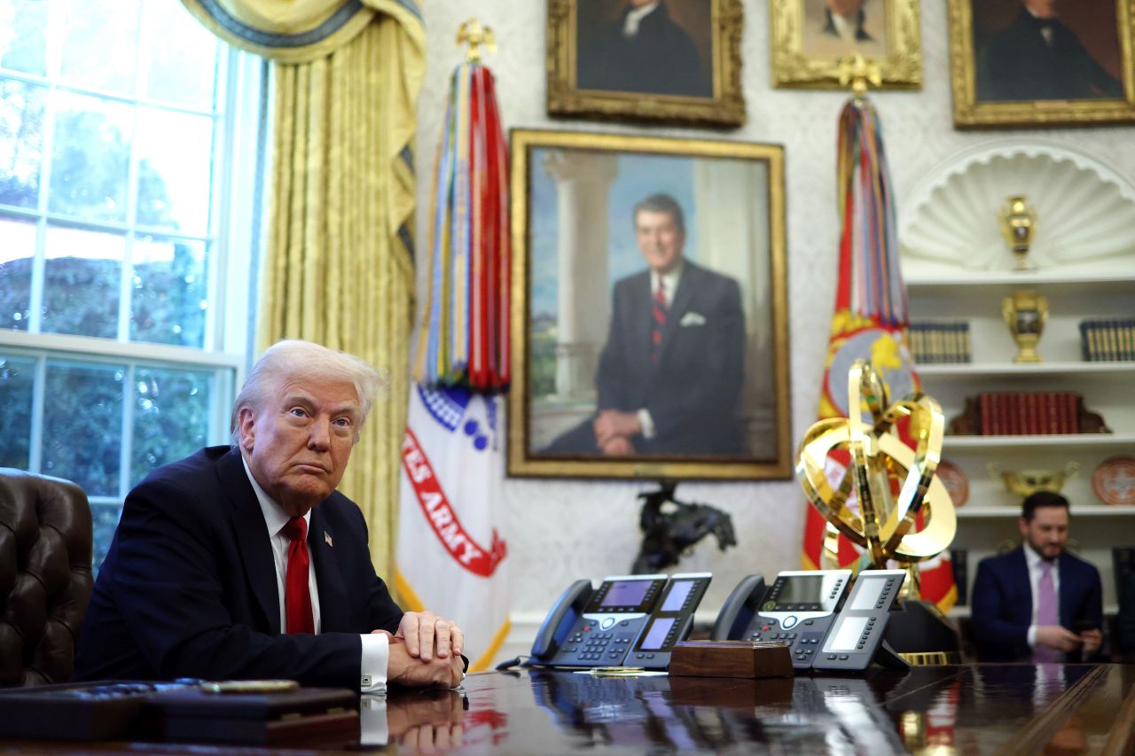 President Donald Trump prepares to sign an executive order in the Oval Office on Wednesday.