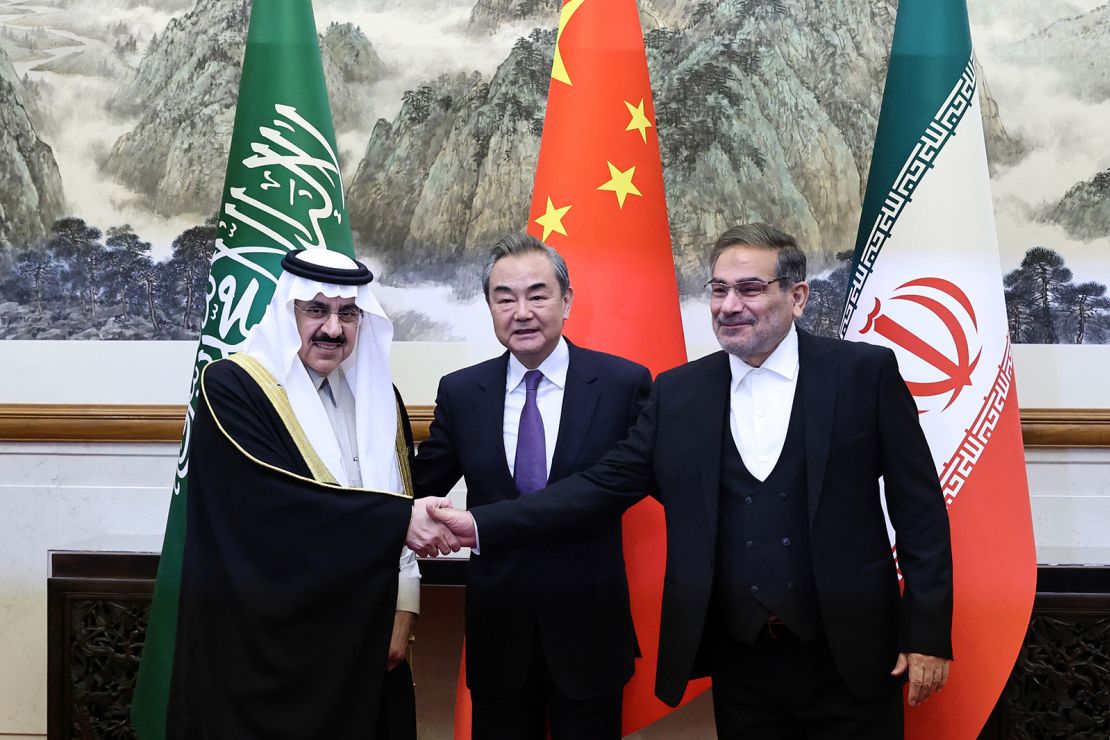 China's top diplomat Wang Yi poses with Iranian Supreme National Security Council Secretary Ali Shamkhani and Saudi Arabia's national security adviser Musaad bin Mohammed Al Aiban in Beijing after the two Middle Eastern nations agreed to re-establish diplomat ties in March 2023.
