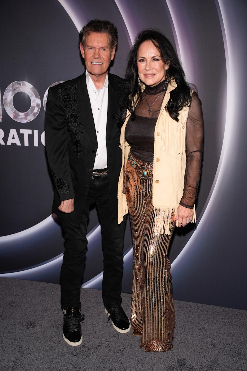 Randy Travis and Mary Davis attend NBC's Opry 100: A Live Celebration event at the Grand Ole Opry in Nashville, Tenn., Wednesday, March 19, 2025.