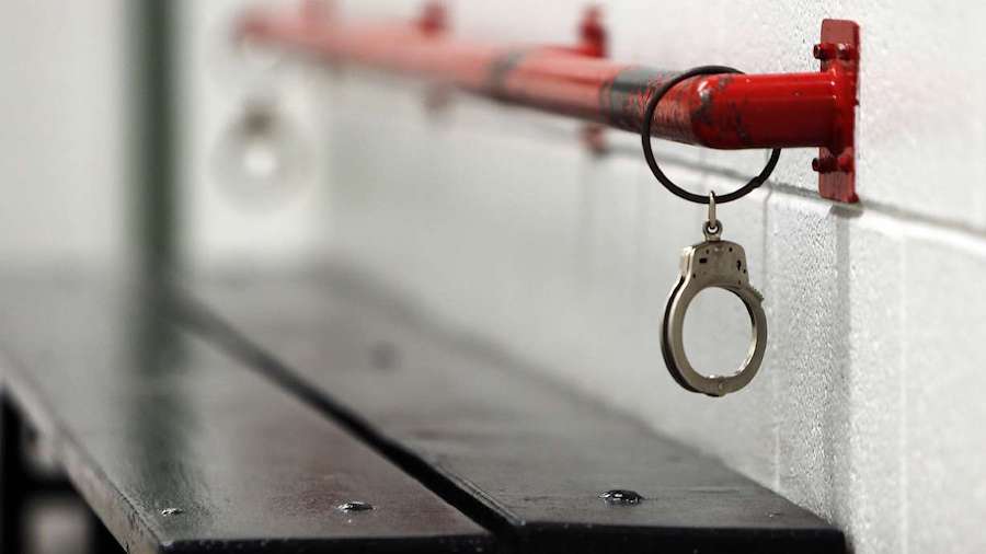 Man accused of 2018 child rape extradited back to Utah from Spain Handcuffs in a jail cell....