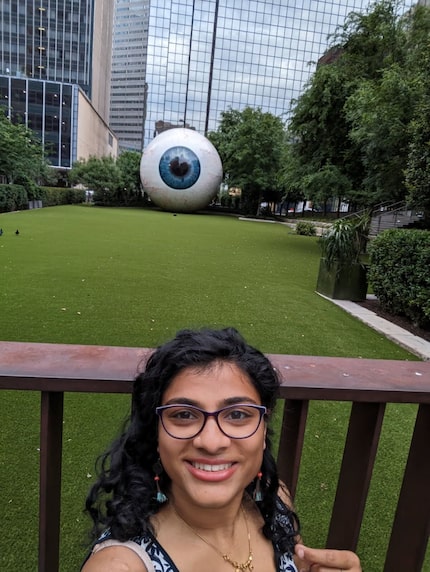 Supraja Varadarajan of UT Southwestern Medical Center standing in front of the Eye in...