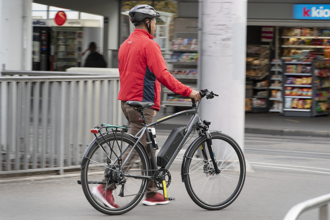 Man with bicycle in Zurich