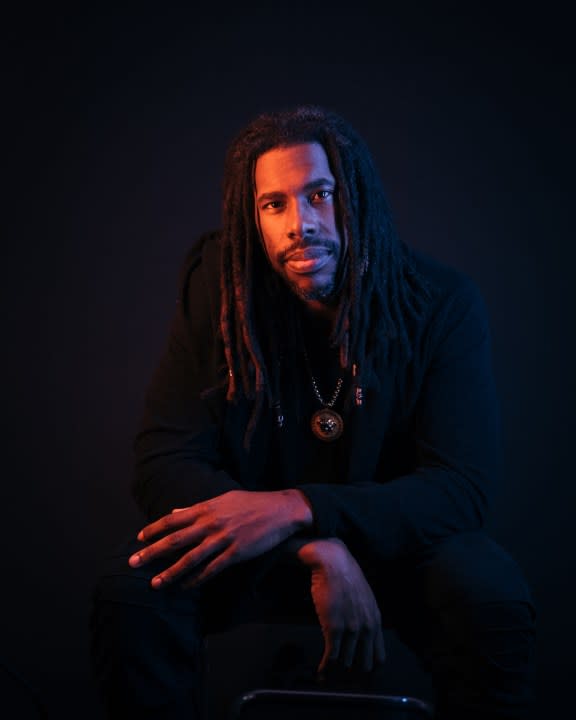 Flying Lotus poses for a headshot.