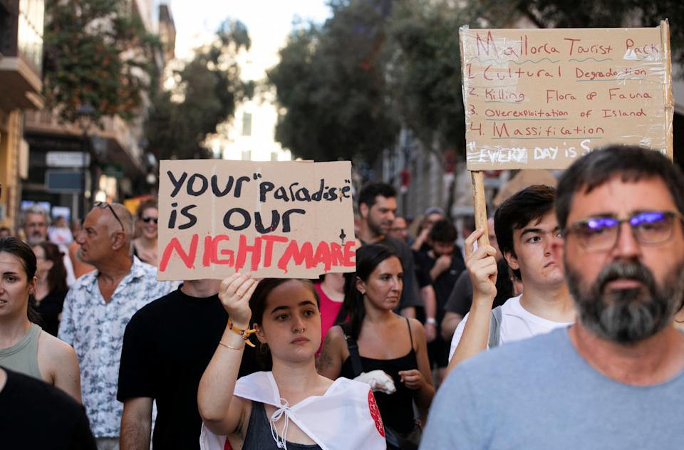People take part in a protest against mass tourism in Palma de Mallorca, Spain, July 21, 2024. REUTERS/Stringer