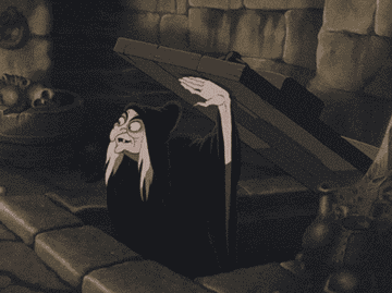 Animated witch emerging from a trapdoor in a dim, dungeon-like setting, appearing sneaky and cautious