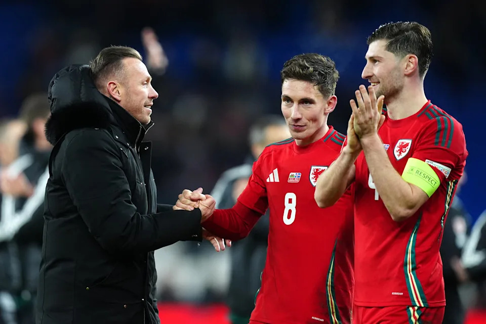 Craig Bellamy congratulates Harry Wilson and captain Ben Davies after Wales topped their Nations League group (David Davies/PA) (PA Wire)