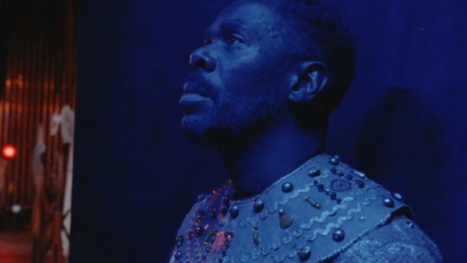 Colman Domingo standing against a wall backstage in Sing Sing. 