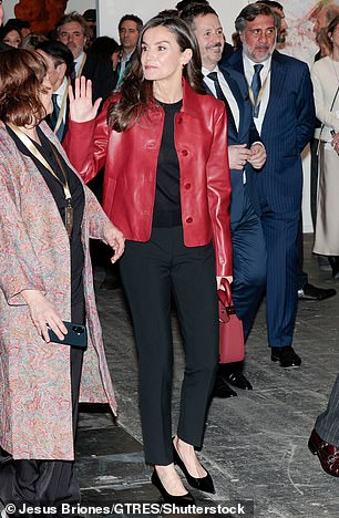 Looking effortlessly chic, the mother-of-two teamed her striking garment with a black jumper and matching smart trousers