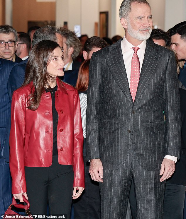 Complementing her ruby leather jacket, the Spanish Queen opted for reddish eye shadow and lipstick to accentuate her stunning facial features