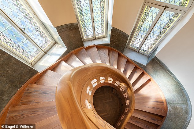 Bespoke: The mansion has a stunning bespoke wooden staircase and large unique windows