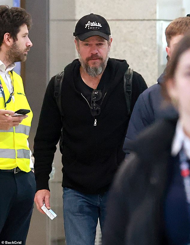 He cut a casual figure in a black zip-up jumper which he teamed with blue denim jeans and white trainers