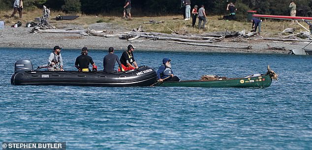 He was also seen kayaking across the lake in a green canoe before filming scenes at the campsite