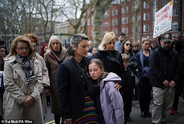 Mourners take part in a minute's silence during a vigil outside The North Macedonian Embassy in London on March 23 in memory of the 59 people who died in the Club Pulse nightclub fire in the eastern town of Kocani