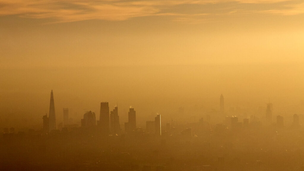 Aerial view South across city of London,air pollution, smog, Shard, towers, London, UK