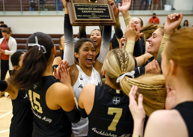 Archbishop Mitty, including Archbishop Mitty's Nicole Macalintal (8), celebrates their 25-11, 25-18, 25-19 win with students over St. Francis for the CIF NorCal Open Division championship game at St. Francis High School in Mountain View, Calif., on Tuesday, Nov. 19, 2024. (Nhat V. Meyer/Bay Area News Group)
