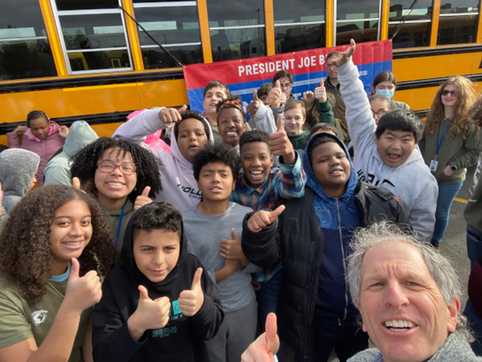 David Cash and students living in Worcester, Mass., at an event celebrating the city’s new electric school bus. According to the Greater Worcester Community Foundation, about 12% of school-age children had asthma in 2018. Credit: Courtesy of David Cash