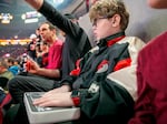 Hank Vogel, age 11, uses a OneCourt tactile device during a Portland Trail Blazers game.