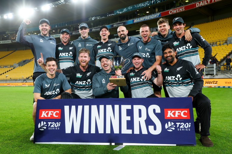 WELLINGTON, NEW ZEALAND - MARCH 26: New Zealand players celebrate with the series trophy after winning game five of the Men's T20 series between New Zealand and Pakistan at Sky Stadium, on March 26, 2025, in Wellington, New Zealand. (Photo by Hagen Hopkins/Getty Images)