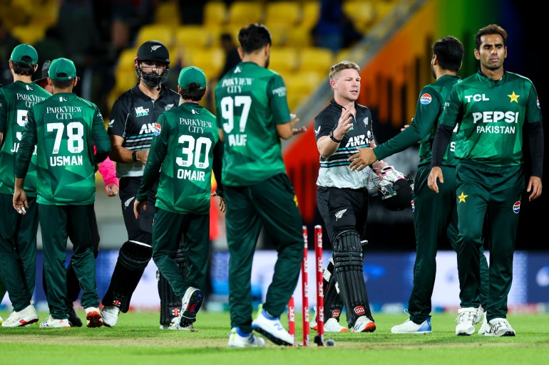 WELLINGTON, NEW ZEALAND - MARCH 26: Tim Seifert and Daryl Mitchell of New Zealand shake hands with Pakistan players after winning game five of the Men's T20 series between New Zealand and Pakistan at Sky Stadium, on March 26, 2025, in Wellington, New Zealand. (Photo by Hagen Hopkins/Getty Images)