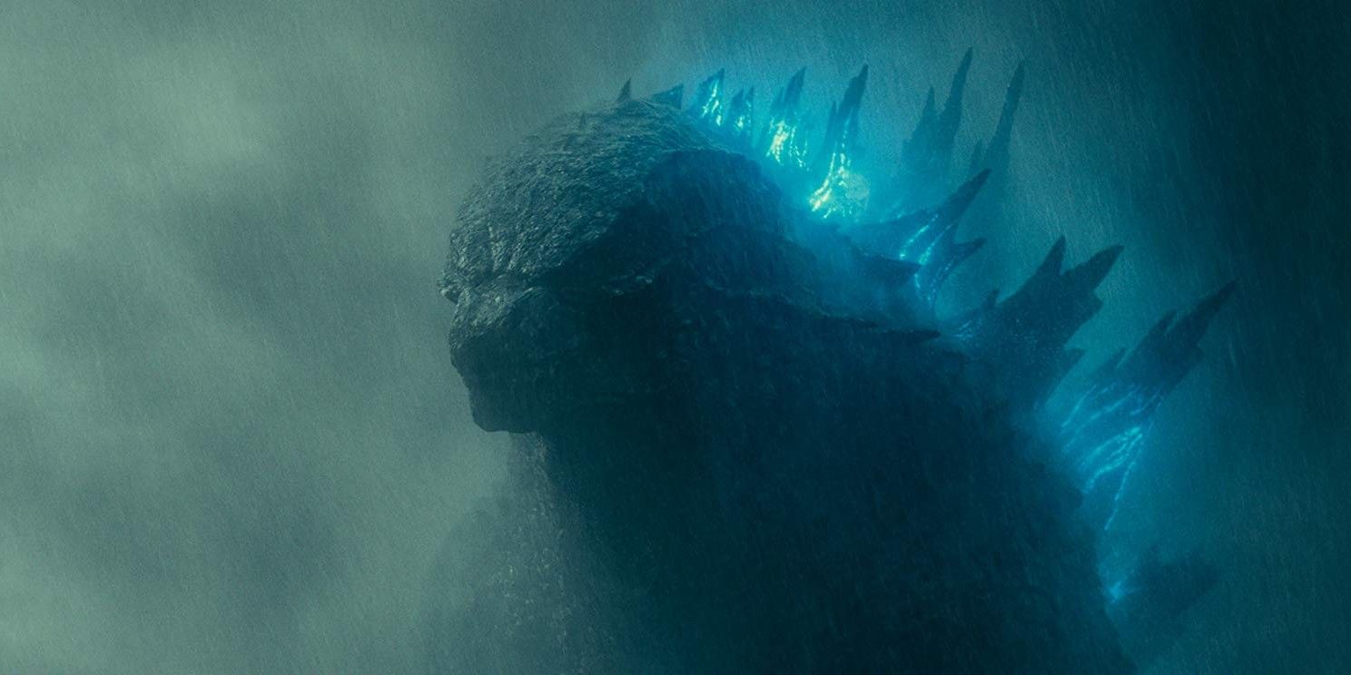 Godzilla in the rain in King of the Monsters with a glowing spine.