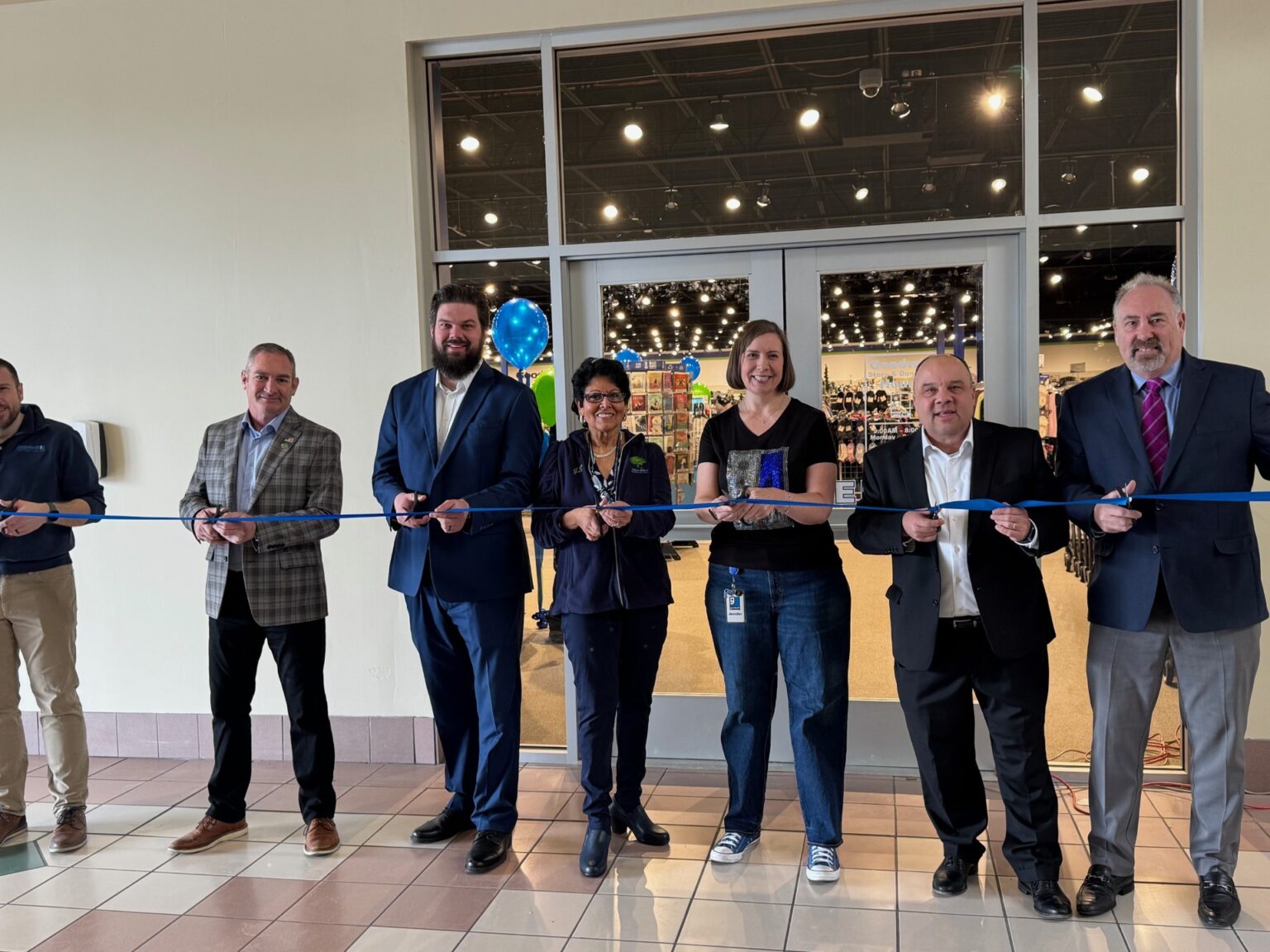 Goodwill opens thrift store at The Mall at Greece Ridge (Left to Right): Dave Wiesner, vice president of Donated Goods Retail, Goodwill of the Finger Lakes; Monroe County Legislator Tom Sinclair; Joshua Greenaker, project designer at SWBR; JudieLynn Nassar McAvinney, Goodwill of the Finger Lakes Board of Directors; Jennifer Lake, president and CEO, Goodwill of the Finger Lakes; Deputy Monroe County Executive Jeff McCann, and Joe Robach, president, Greece Chamber of Commerce. (photo courtesy of Goodwill of the Finger Lakes)