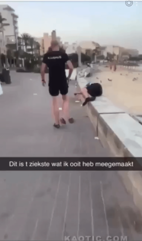 A tourist defecates on a sleeping Spanish man.
