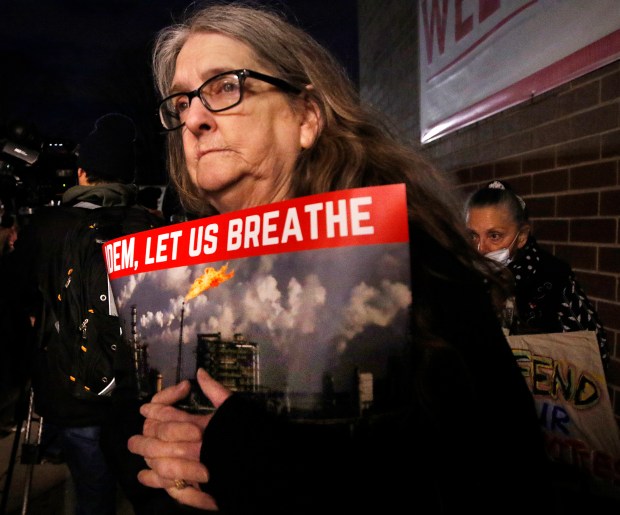 Marktown resident Kimberly Rodriguez waits outside for the public meeting to start at East Chicago Central High School. Residents were stopped at the doors of high school for what was to be an Indiana Department of Environmental Management public hearing on the renewal of the BP refinery air permit on Thursday, February 8, 2024. (John Smierciak/Post-Tribune)