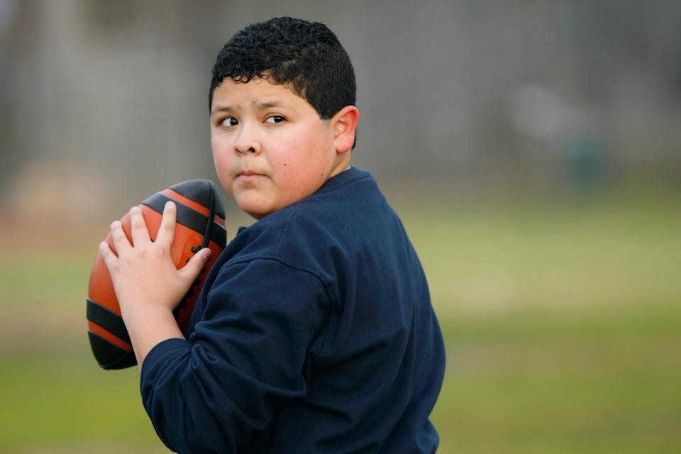 Manny with a football on Modern Family