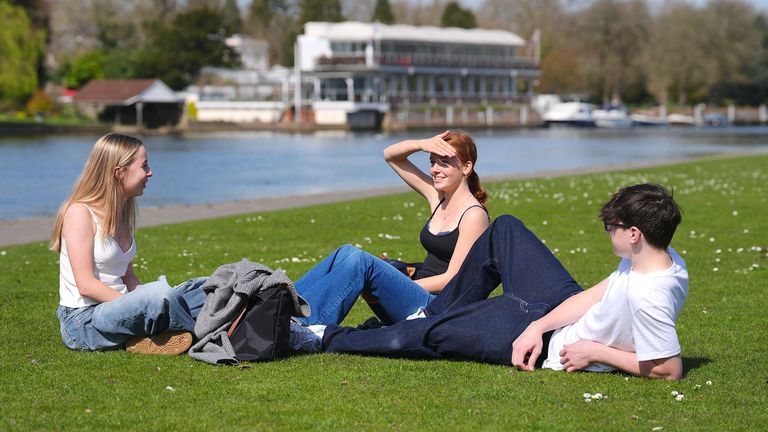 (left to right) Florence Hulcup, Jessica Kemp, and Tom Spann enjoy the good weather beside the River Thames in Henley-on-Thames, Oxfordshire. Parts of the UK could be hotter than Ibiza this week as temperatures continue to rise amid a week of dry and sunny weather. Picture date: Monday March 31, 2025. PA Photo. Photo credit should read: Jonathan Brady/PA Wire