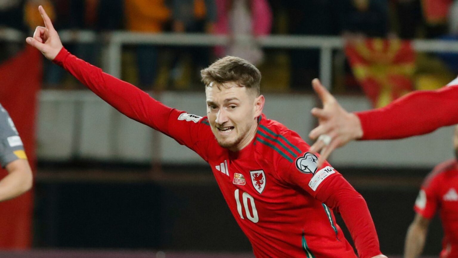 Wales' David Brooks, second left, celebrates with team-mates after scoring his side's opening goal during a World Cup 2026 group J qualifying soccer match between North Macedonia and Wales at National Arena Todor Proeski in Skopje, North Macedonia, Tuesday, March 25, 2025. (AP Photo/Boris Grdanoski)