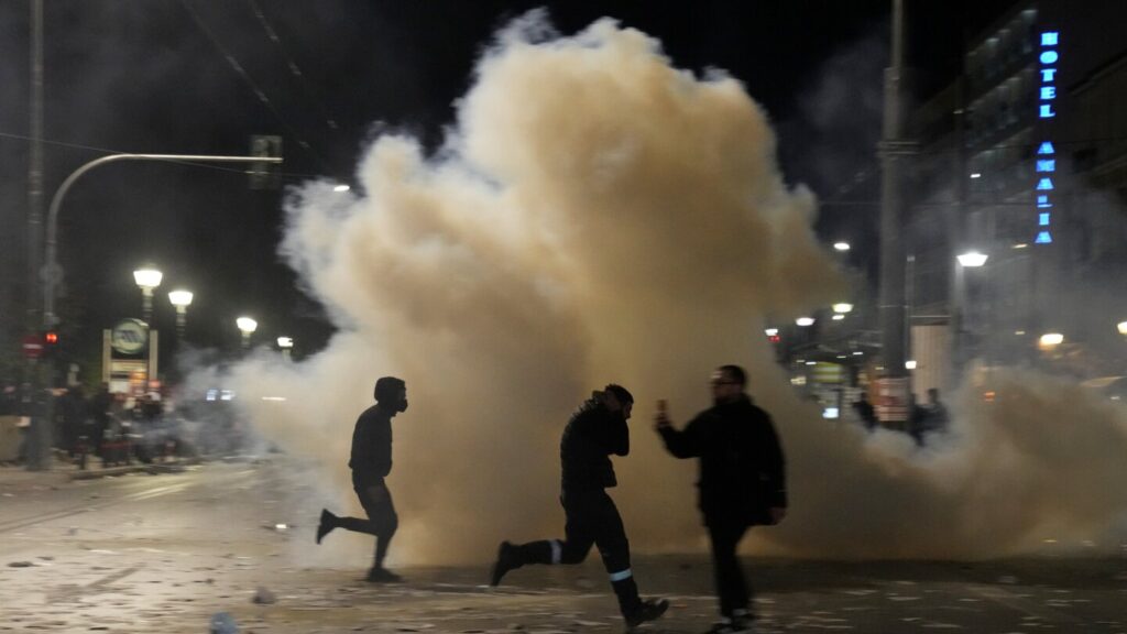 Protesters and police clash as Greece’s government battles censure motion over deadly train crash Protesters and police clash as Greece's government battles censure motion over deadly train crash