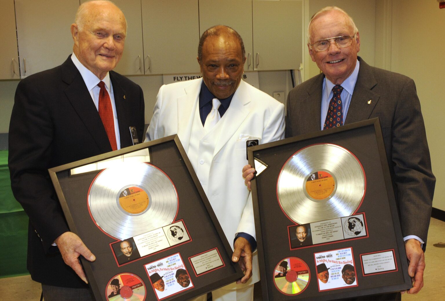 Quincy Jones presents platinum copies of Frank Sinatra’s “Fly Me to the Moon” to Senator John Glenn and Apollo 11 Commander Neil Armstrong in 2008. Quincy Jones presents platinum copies of Frank Sinatra's "Fly Me to the Moon" to Senator John Glenn and Apollo 11 Commander Neil Armstrong in 2008.