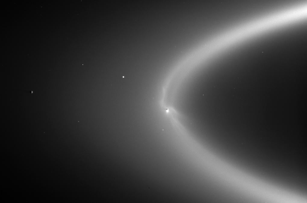 Enceladus orbiting within Saturn's E-ring, NASA 2006