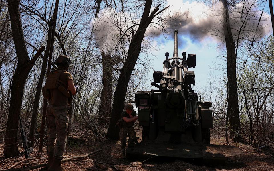 Ukrainian troops firing a howitzer on the front line in the Donetsk region on Friday