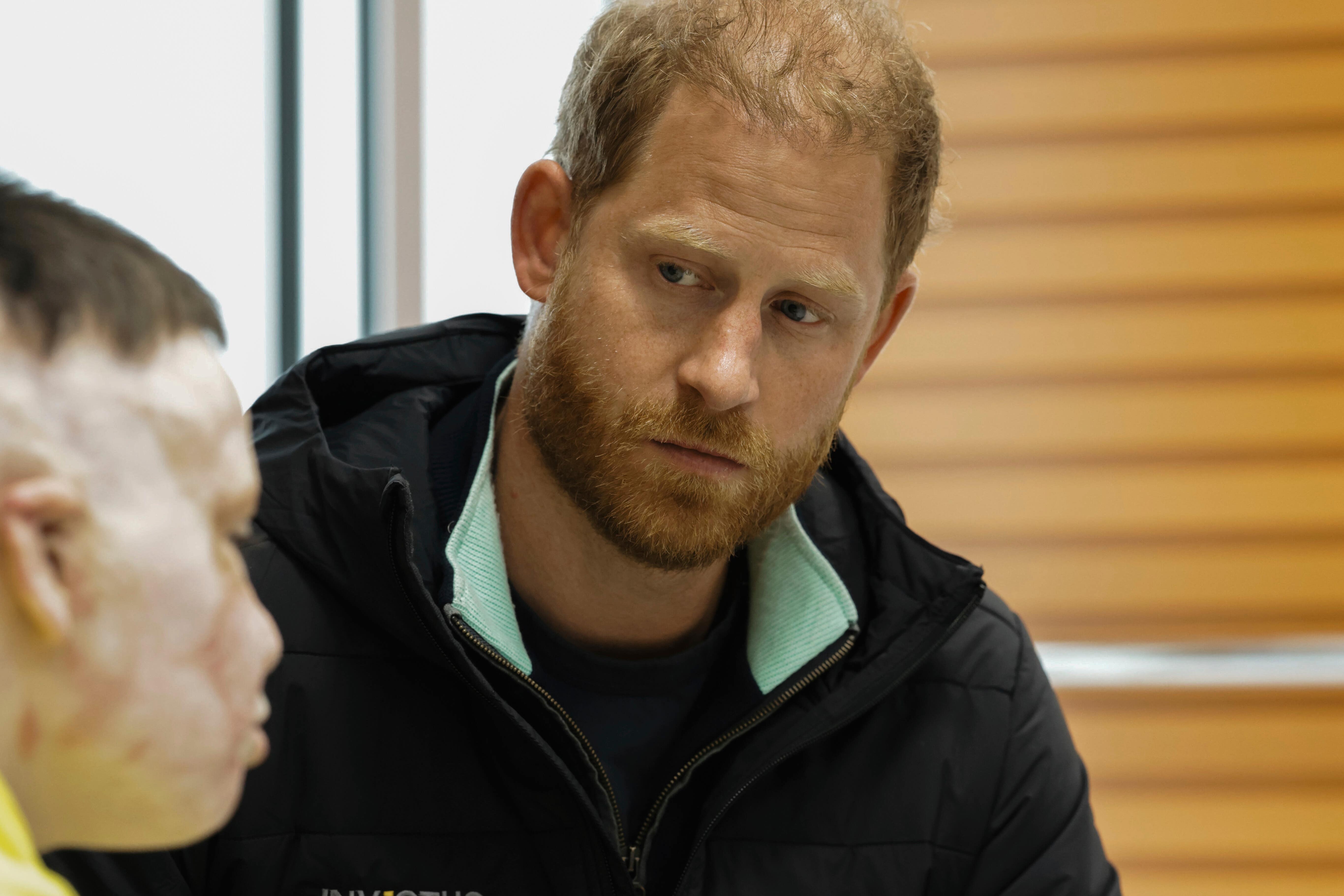 The Duke listens to a Ukrainian man during his visit to the Superhumans Center, an orthopedic clinic in Ukraine
