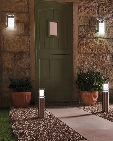 Solar welcome lights illuminating a walkway.
