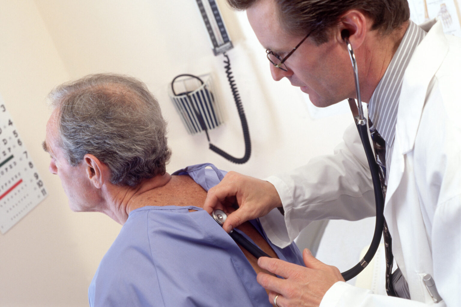 Doctor examines patient