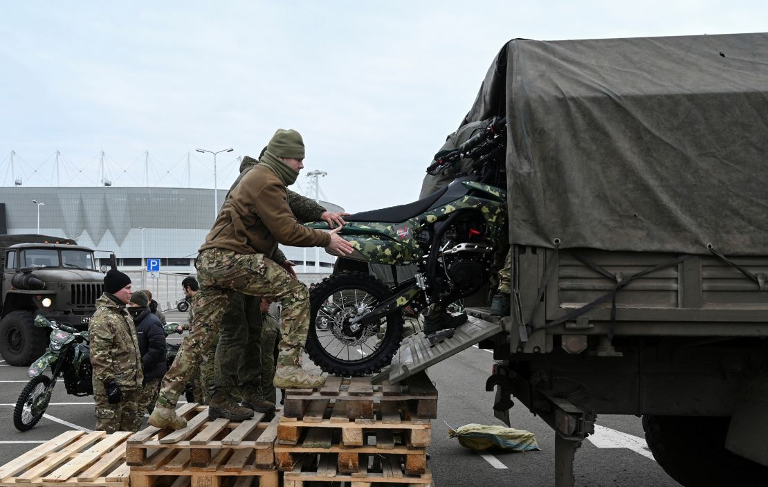 Participants load motorcycles into a truck during a ceremony to hand over to the Russian military in Rostov-on-Don, Russia, November 28, 2024.