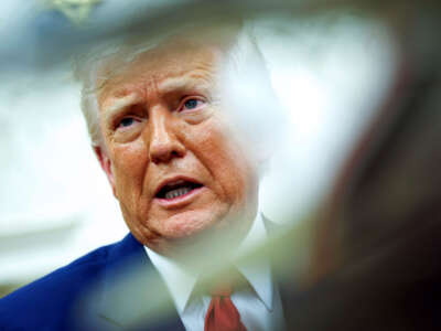 President Donald Trump answers a reporter's question during a meeting in the Oval Office of the White House on April 7, 2025, in Washington, D.C.