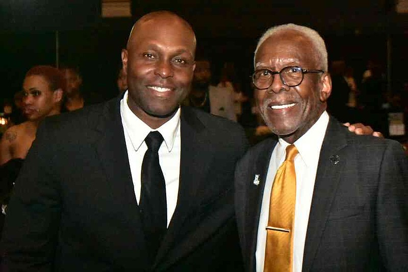 Former major league outfielder Torii Hunter and UAPB basketball great Jesse Mason pose for a photo. (Pine Bluff Commercial/I.C. Murrell)