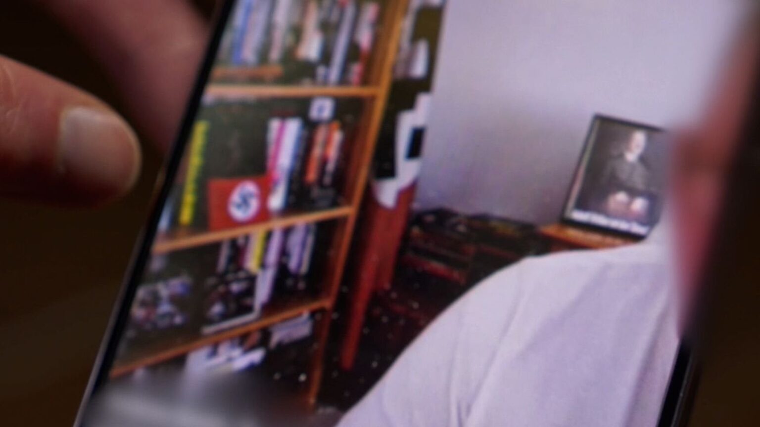 NHS manager joins work call with Nazi paraphernalia in background