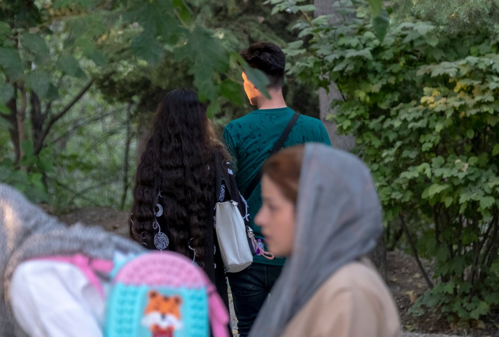 An Iranian couple walking together in a park in central Tehran, Iran. In the religiously conservative Islamic republic, finding Mr or Miss Right can be especially tough. Photo: NurPhoto via Getty Images An Iranian couple walking together in a park in central Tehran, Iran. In the religiously conservative Islamic republic, finding Mr or Miss Right can be especially tough. Photo: NurPhoto via Getty Images