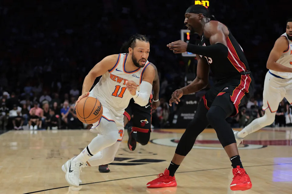 New York Knicks guard Jalen Brunson (11) drives to the basket against Miami Heat center Bam Adebayo (13).Sam Navarro-Imagn Images