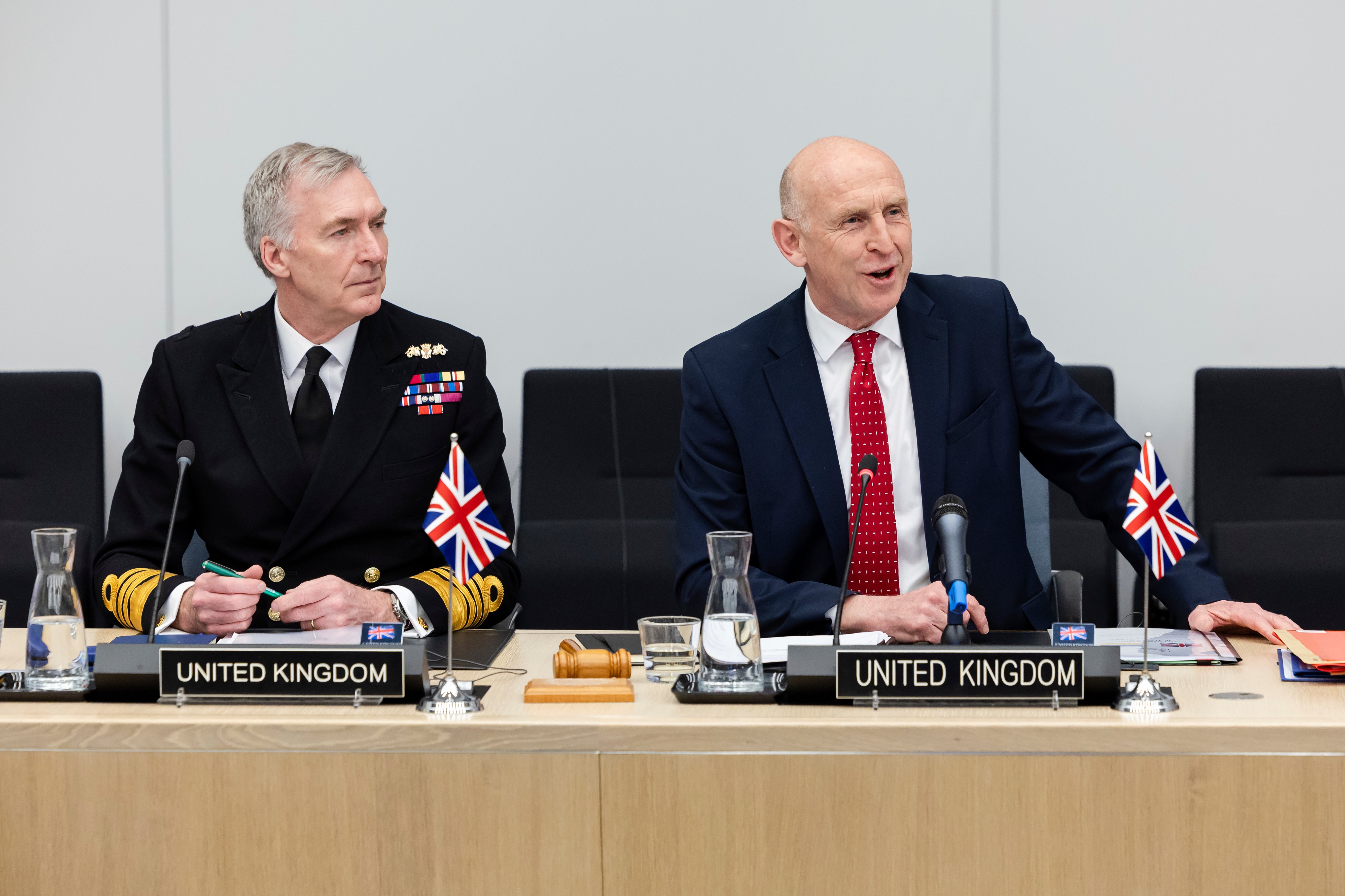 Britain's defence secretary John Healey sits next to Britain's Chief of the Defense Staff Admiral Tony Radakin