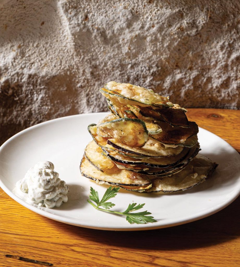Estia Chips, thinly sliced and lightly fried zucchini and eggplant served with tzatziki. Photo by Stills by Herman
