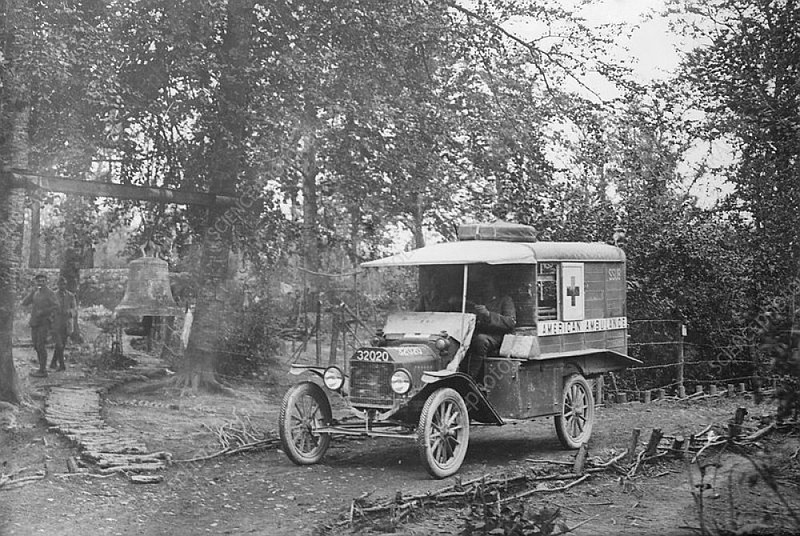 An American Field Service Ford Model T ambulance stands by in the Woevre Forest, Meuse, France, during World War I. AFS drivers were all volunteers, mainly recruited from college campuses. The bell at left was used to warn of gas attacks. (Special to the Democrat-Gazette/Library of Congress)