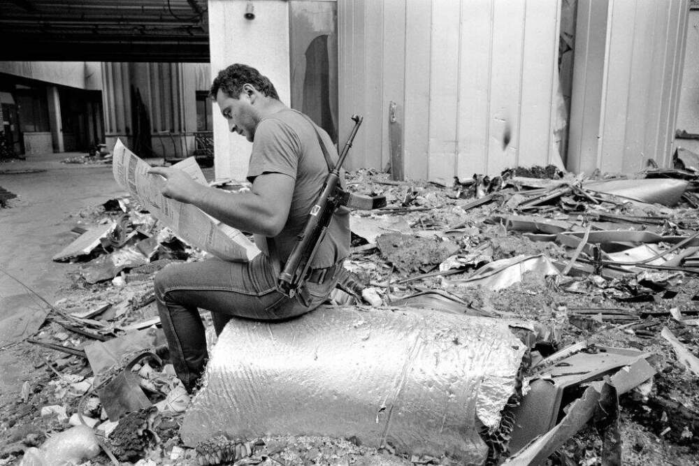 How the Temporary Protected Status program saved my life A Bosnian fighter reads a copy of Oslobodenje at the Sarajevo newspaper's destroyed offices in Sarajevo, Bosnia, in July 1992. During the 47-month siege of Sarajevo, more than 10,600 people were killed and 56,000 wounded or maimed. (Getty Images)