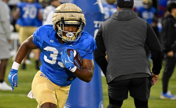 Karson Cox #33 of the UCLA Bruins during UCLA football...